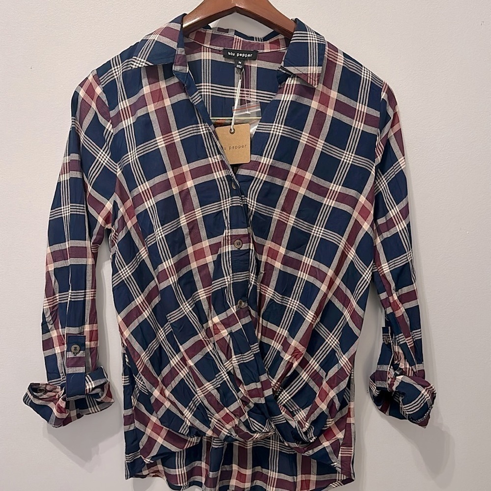 Plaid collared asymmetrical top with blue and red plaid design. NWT